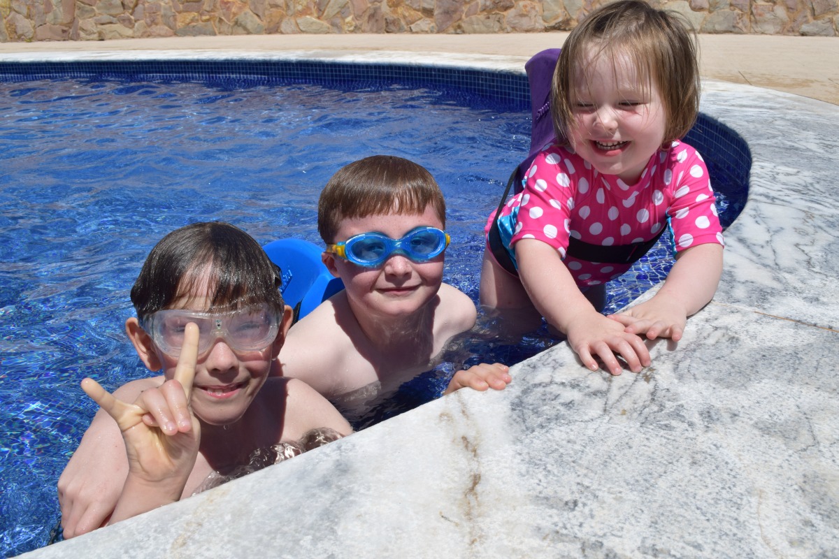 Kids together in the pool