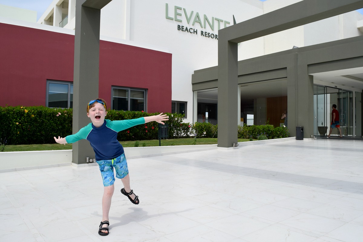 Levante Beach Resort with Sam in front